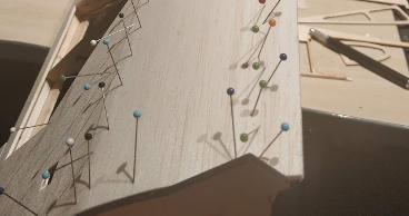 Photo of wing leading edge held with pins whilst gluing